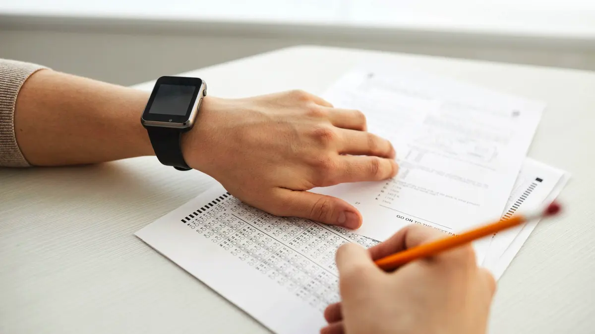 A pencil filling in bubbles on a multiple-choice answer sheet.
