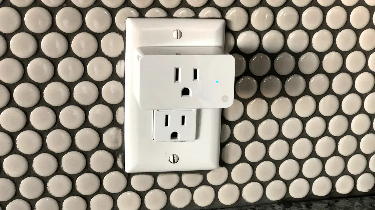 A smart plug in a wall socket.