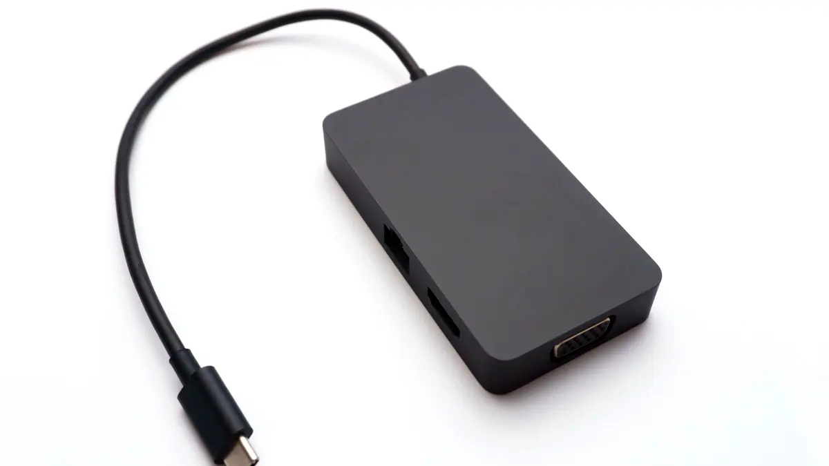 A USB-C hub showing HDMI, USB and Ethernet ports.
